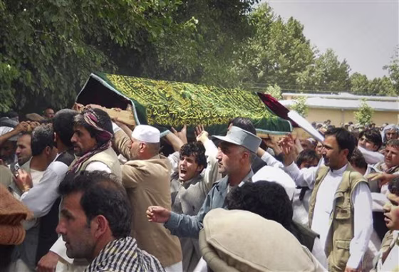 Mourners carry the covered coffin of Gen. Daud Daud during his funeral ceremony in Farkhar, Takhar north of Kabul, Afghanistan. Daud, an ethnic Tajik, was the fifth minority leader slain by militants in recent months. 